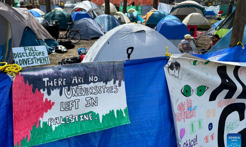 Pro-Palestinian demonstrators are seen in an encampment of tents in front of Tabaret Hall at the University of Ottawa in Ottawa, Canada, May 3, 2024. (Photo by Min Chen/Xinhua)