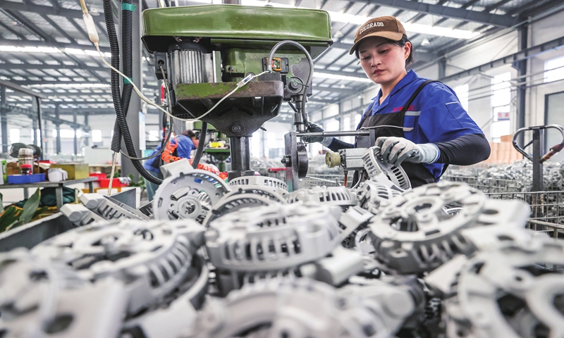 A worker produces auto parts at an enterprise in Lianyungang, East China's Jiangsu Province on May 6, 2024. Multiple local enterprises are catching up on domestic and international orders after the May Day holidays. Photo: VCG