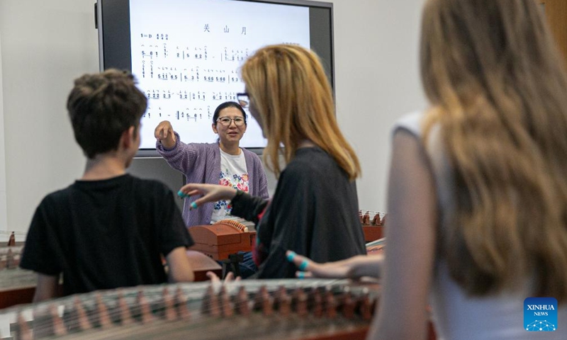 A teacher (rear) instructs during a guzheng (a traditional Chinese musical instrument) class at the China Cultural Center in Belgrade, Serbia, April 29, 2024. The China Cultural Center in Belgrade, jointly built by China's Ministry of Culture and Tourism and the provincial government of Shandong, opened to the public recently. The center covers an area of 6,000 square meters and offers classes on Chinese language, traditional Chinese musical instruments, Chinese calligraphy, and Tai Chi. Photo: Xinhua