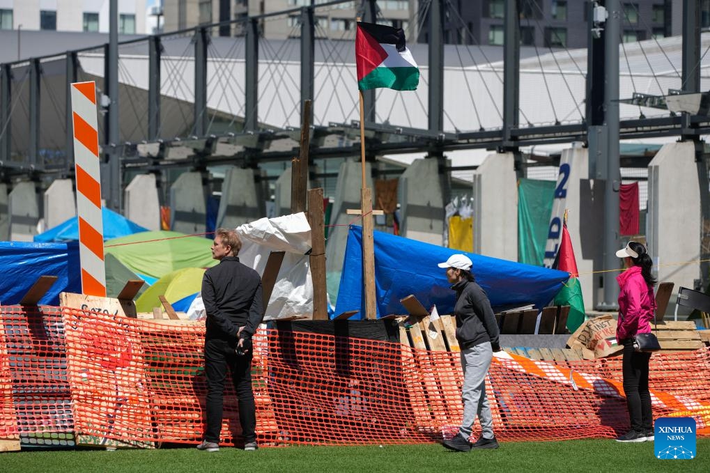 People are seen near an encampment on the Vancouver campus of the University of British Columbia in Vancouver, British Columbia, Canada, on May 6, 2024.(Photo: Xinhua)