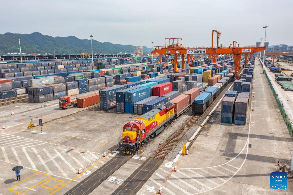 A drone photo taken on May 5, 2024 shows a China-Europe freight train waiting to depart from the Tuanjiecun Station in the Chongqing International Logistics Hub Park in southwest China's Chongqing Municipality. The Chongqing International Logistics Hub Park, which includes the Tuanjiecun Station, the dry port of the New International Land-Sea Trade Corridor, and the Chongqing Railway Port, has risen to be a major hub of international freight trains in the country's western region.(Photo: Xinhua)