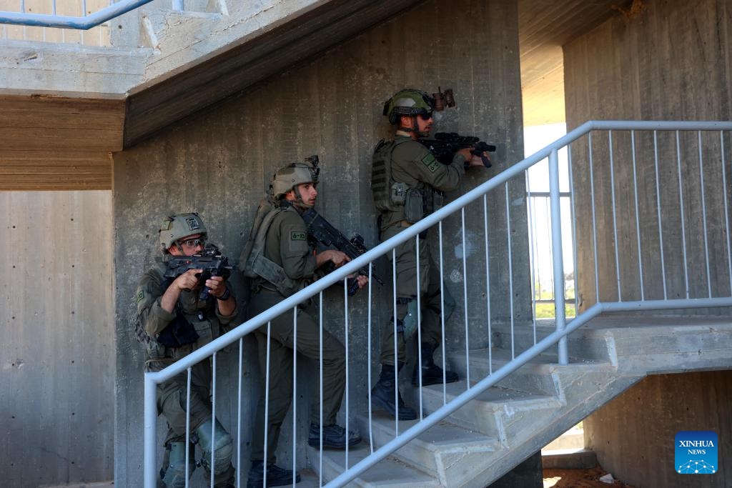 Israeli soldiers take part in a drill before entering Gazan city of Rafah near the Kerem Shalom crossing in Israel, on May 7, 2024.(Photo: Xinhua)