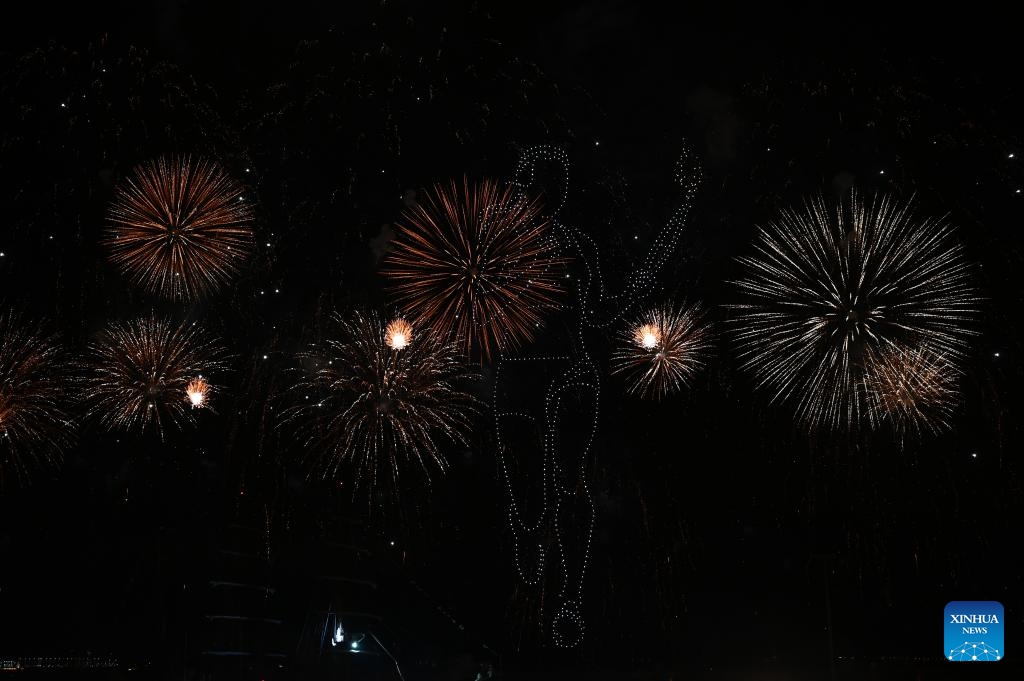 Fireworks and drone show are seen before the arrival of the Olympic Flame at the old port in Marseille, southern France at the night of May 7, 2024.(Photo: Xinhua)