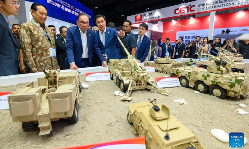 Malaysian Prime Minister Anwar Ibrahim (3rd L) visits the pavilion of China defence at Defense Services Asia 2024 in Kuala Lumpur, Malaysia, May 6, 2024. Defense Services Asia 2024, a biennial defense and weaponry show, opened in the Malaysian capital Kuala Lumpur on May 6.(Photo: Xinhua)