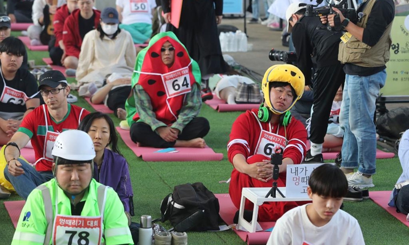 Competitors participate in a space-out competition at Banpo Han River Park in Seoul, South Korea, May 12, 2024. A total of 80 teams participated in a space-out competition held at Banpo Han River Park in Seoul on Sunday. The winner was selected based on the participants' heart rate and the vote of the audience. Photo: Xinhua