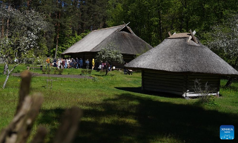 People attend a celebration at the Ethnographic Open-Air Museum of Latvia, in Riga, Latvia, on May 11, 2024. Covering about 87 hectares, this biggest open-air museum in Latvia held its centennial celebration on Saturday. Photo: Xinhua