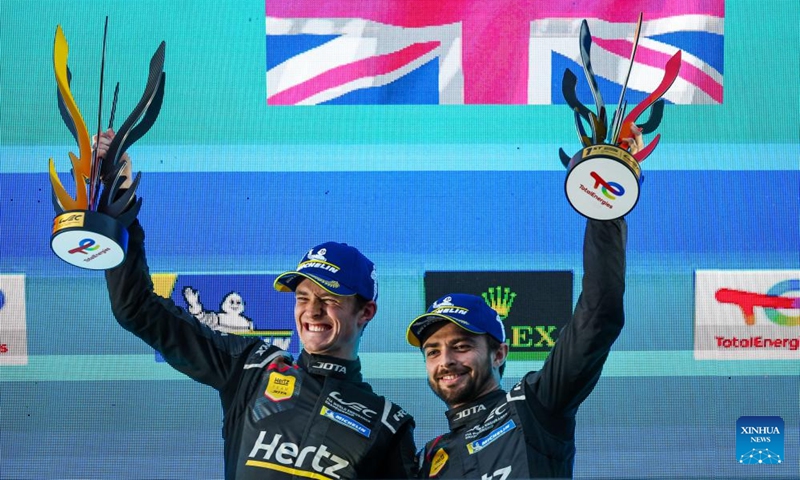 The #12 Hertz Team Jota's British drivers Will Stevens (R) and Callum Ilott celebrate their victory during the awarding ceremony of the Hypercar category at the 2024 FIA World Endurance Championship (WEC) at Circuit de Spa-Francorchamps in Stavelot, Belgium, May 11, 2024. Photo: Xinhua