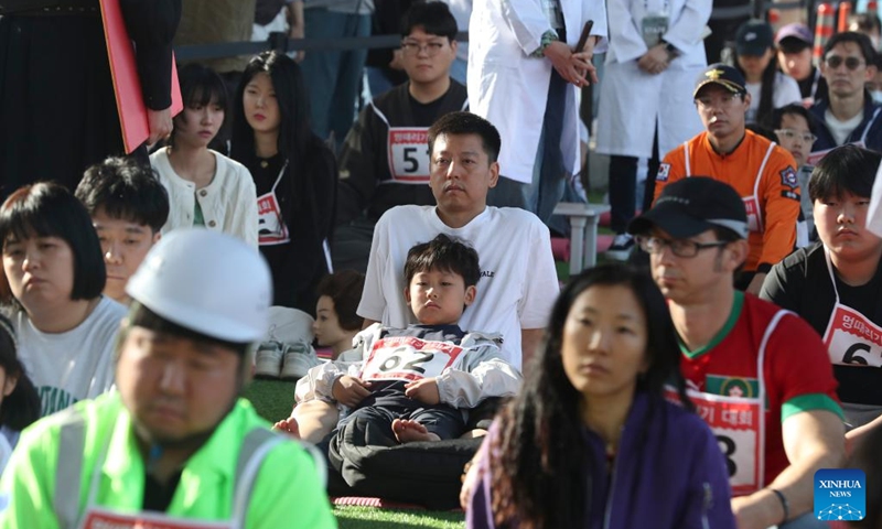 Competitors participate in a space-out competition at Banpo Han River Park in Seoul, South Korea, May 12, 2024. A total of 80 teams participated in a space-out competition held at Banpo Han River Park in Seoul on Sunday. The winner was selected based on the participants' heart rate and the vote of the audience. Photo: Xinhua