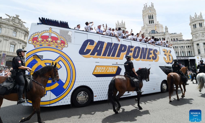 Players of Real Madrid parade on a bus during a ceremony of Real Madrid's celebration after winning the champion of the 2023-2024 Spanish La Liga in Madrid, Spain, May 12, 2024. Photo: Xinhua