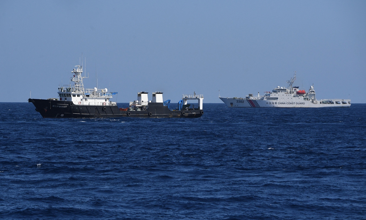 Chinese vessels sail in waters near China's Huangyan Dao to drive away Philippine vessels illegally intruding into waters adjacent to Huangyan Dao, on February 15, 2024.Photo: Visual News