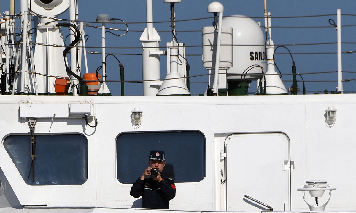 The China Coast Guard takes photos of the vessel of the Philippine Bureau of Fisheries and Aquatic Resources illegally intruding into waters adjacent to China's Huangyan Dao, on February 15, 2024. Photo: VCG
