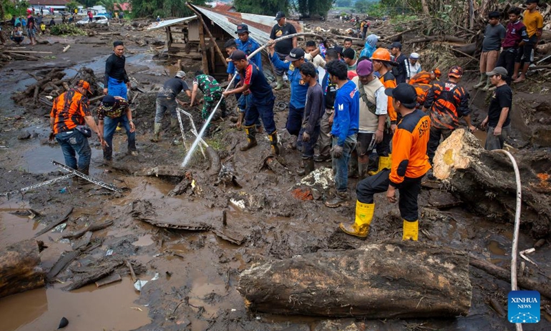 Rescue team members work in a damaged area after a cold lava flood at Agam regency in West Sumatra, Indonesia, on May 12, 2024. The death toll from lava floods that struck Indonesia's West Sumatra province on Saturday rose to 34, with at least five others missing, a senior official of the local disaster agency said on Sunday. Photo: Xinhua