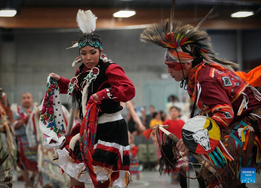 Dancers perform during the Mother's Day Traditional Powwow in Vancouver, British Columbia, Canada, on May 12, 2024. Hundreds of indigenous people from various tribes across Canada gathered on Sunday to celebrate Mother's Day with a powwow, a traditional social gathering featuring music and dance.(Photo: Xinhua)