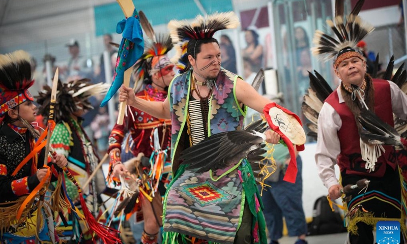 Dancers perform during the Mother's Day Traditional Powwow in Vancouver, British Columbia, Canada, on May 12, 2024. Hundreds of indigenous people from various tribes across Canada gathered on Sunday to celebrate Mother's Day with a powwow, a traditional social gathering featuring music and dance.(Photo: Xinhua)