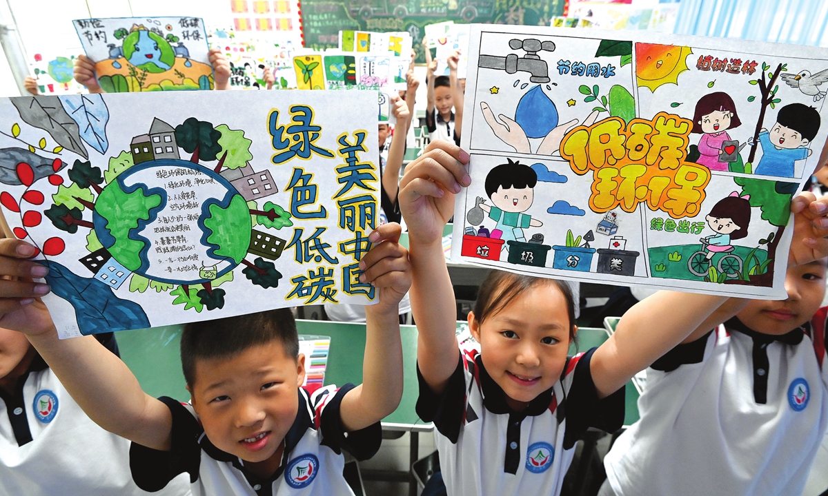 
Students present a low-carbon environmental protection themed poster in Handan, North China's Hebei Province, on May 14, 2024. The school carried out themed education activities on low-carbon living and students advocated for a green lifestyle through making handicrafts using waste materials and playing garbage classification games in preparation for the National Low-Carbon Day on May 15. Photo: VCG