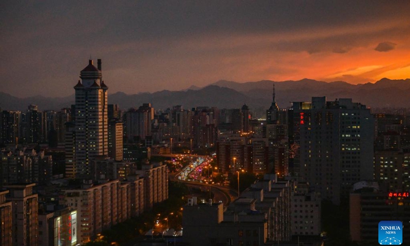 This photo taken on May 14, 2024 shows the sunset glow over Beijing, capital of China. (Photo: Xinhua)