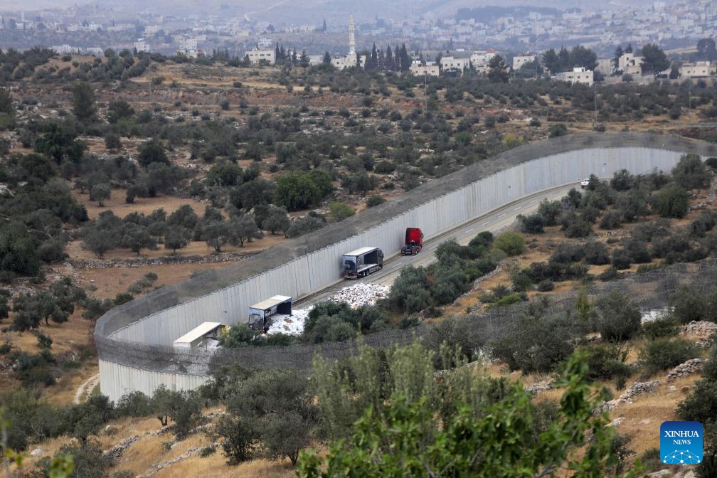 Photo taken on May 14, 2024 shows trucks carrying aid to Gaza damaged by Israeli settlers near the West Bank city of Hebron.(Photo: Xinhua)