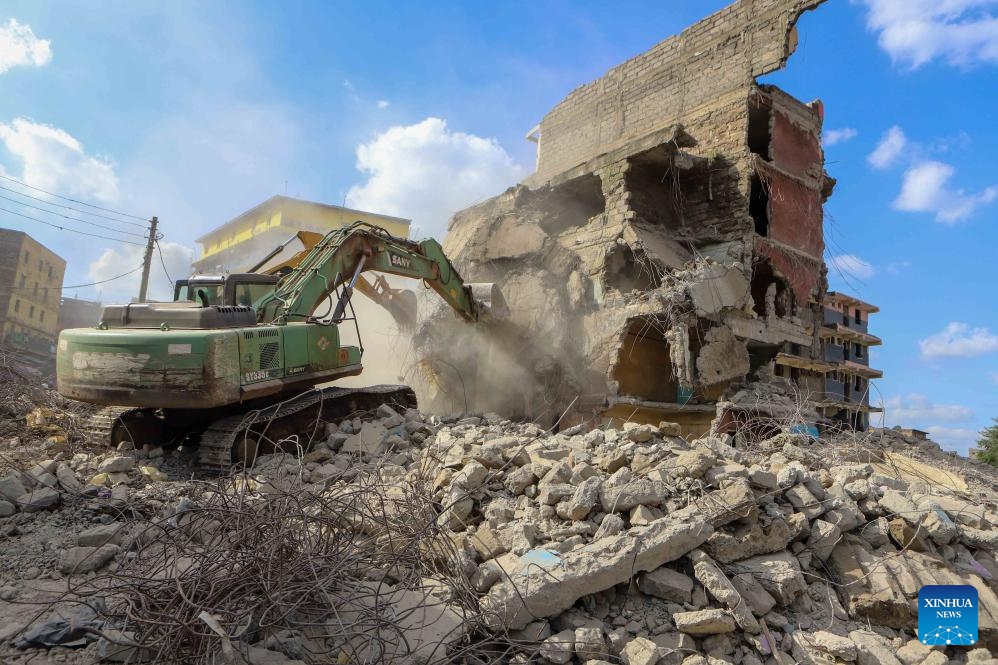 Excavators work on a collapsed residential building in the Kiamaiko area in Nairobi, Kenya, on May 14, 2024. Four people were rescued from the rubble of a collapsed residential building on Tuesday in the Kiamaiko area, a police officer said.(Photo: Xinhua)