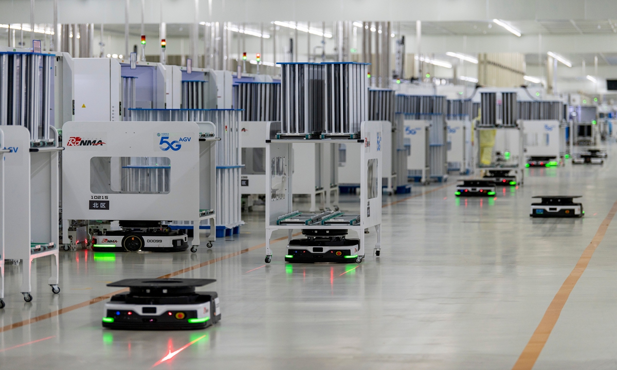 Automatic guided vehicles travel through a production unit at an intelligent factory in Jinhua, East China's Zhejiang Province on May 15, 2024. The build-up of intelligent factories has helped local enterprises accelerate production to fill orders for new-energy items.  Photo: VCG
