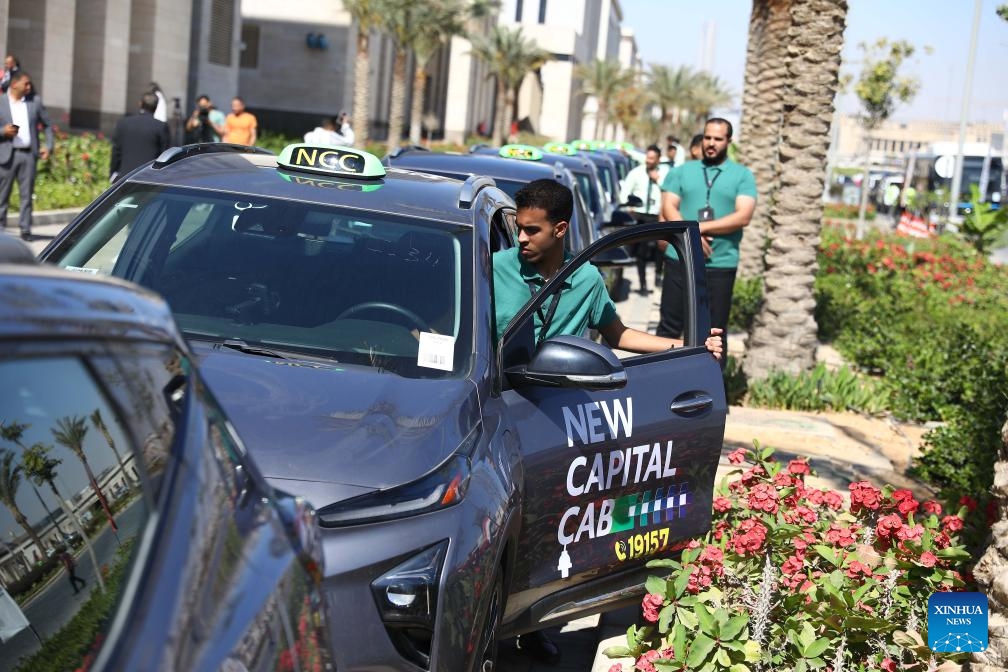 Electric taxis are seen during a pilot program ceremony in New Administrative Capital, Egypt, on May 15, 2024. Egypt kicked off the pilot program on Wednesday for operating the country's first fleet of electric taxis in its newly-built New Administrative Capital (NAC), aiming to provide eco-friendly and smart transportation options.(Photo: Xinhua)