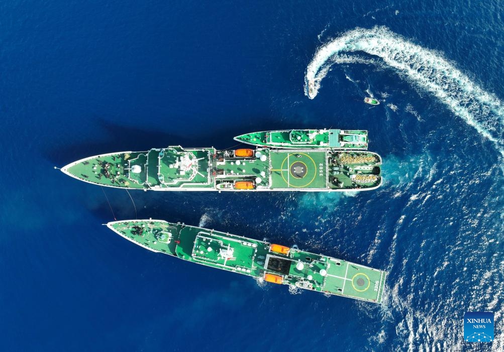 An aerial drone photo taken on May 13, 2024 shows the vessel China Coast Guard (CCG) 3502 carrying out replenishment for other vessels in the South China Sea. The CCG conducted a regular training during operations of rights protection and law enforcement in the waters of Huangyan Dao.(Photo: Xinhua)