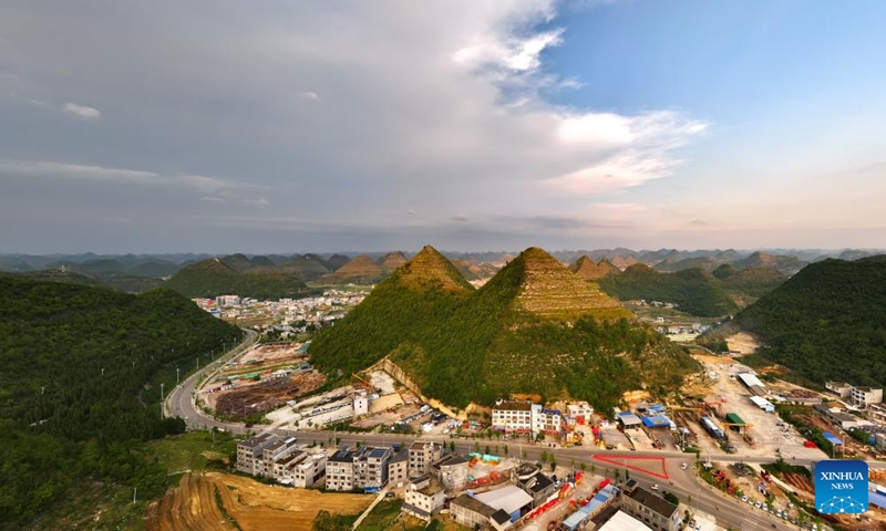 An aerial photo taken on May 14, 2024 shows a view of pyramid-shaped hills in Anlong County, southwest China's Guizhou Province. Several hills that resemble the pyramids of Egypt in a suburb of Anlong have recently become a popular tourist attraction. It appears that these hills are made of parallel layers of stones.(Photo: Xinhua)