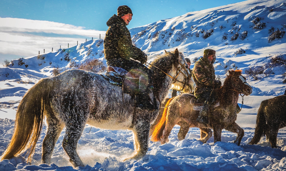 Locals ride horses in Altay Prefecture, Xinjiang in winter.Photo: VCG