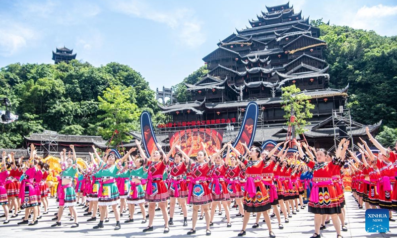 People from the Miao ethnic group celebrate the Caihuashan festival in Chiyou Jiuli Town of Pengshui Miao-Tujia Autonomous County, southwest China's Chongqing, May 15, 2024. The Caihuashan festival is a traditional Miao festival which derives from courtship rituals, where young people meet and make acquaintance by singing and dancing together. The festival celebrations have become increasingly popular in recent years with the development of local tourism and the promotion of Miao ethnic cultures.(Photo: Xinhua)