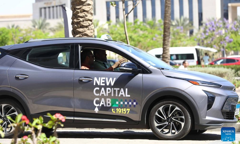 People experience an electric taxi during a pilot program ceremony in New Administrative Capital, Egypt, on May 15, 2024. Egypt kicked off the pilot program on Wednesday for operating the country's first fleet of electric taxis in its newly-built New Administrative Capital (NAC), aiming to provide eco-friendly and smart transportation options.(Photo: Xinhua)