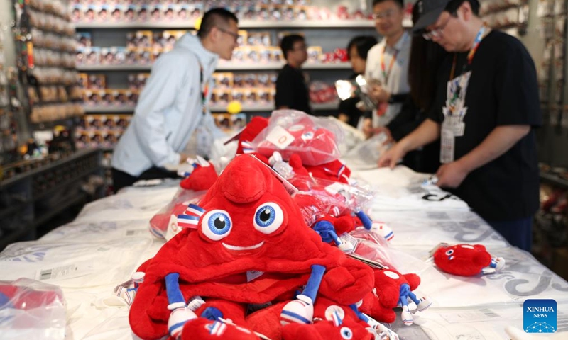 Official mascots of Paris 2024 Olympic Games are seen at an official store prior to the Olympic Qualifier Series Shanghai in east China's Shanghai, May 15, 2024. The Olympic Qualifier Series for BMX freestyle, skateboarding, breaking and sport climbing will be held in an urban park at the Huangpu Riverside from May 16 to 19, 2024.(Photo: Xinhua)