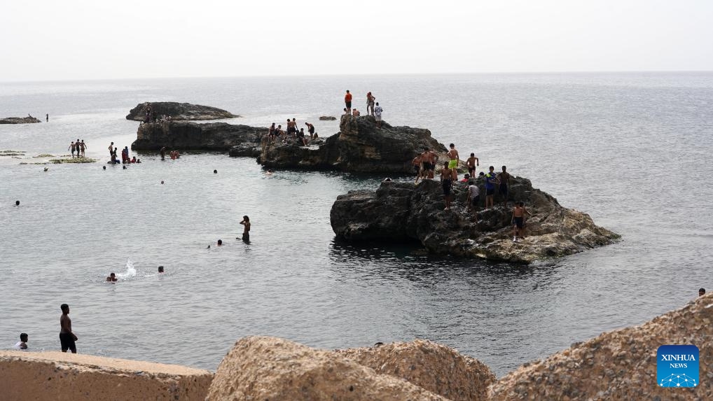 People enjoy leisure time in the sea in Tripoli, Libya, May 15, 2024. The hot air is affecting most regions of the country according to the National Center of Meteorology in Libya.(Photo: Xinhua)