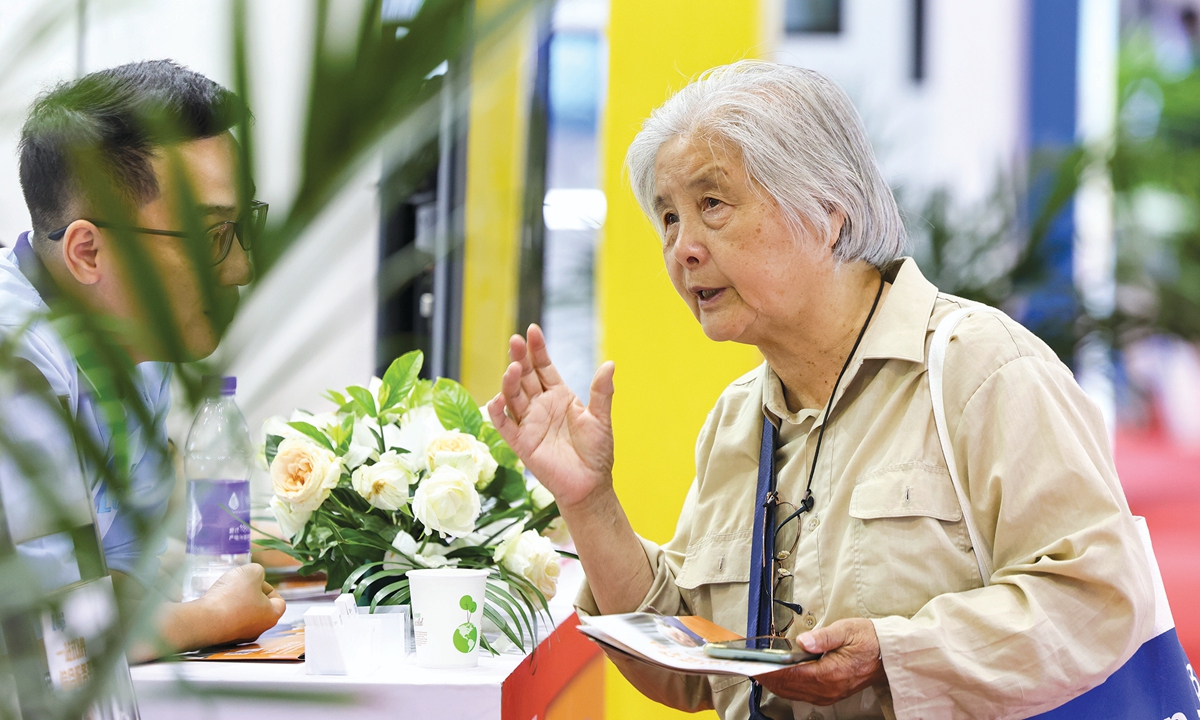 An elderly lady visits the 10th China International Senior Services Expo in Beijing on May 21, 2024. The expo features domestic and international elderly care service brands, smart elderly care information technology, age-friendly equipment and supplies, etc. Photo: VCG 