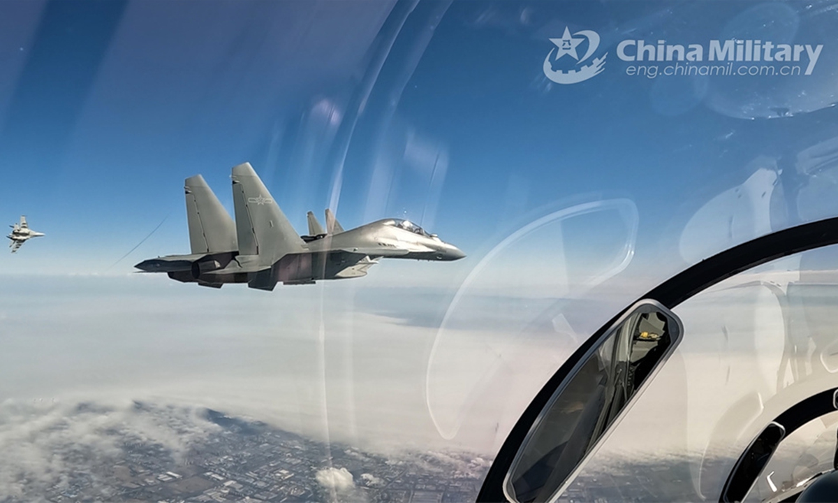 Fighter jets attached to an aviation brigade under the PLA Air Force fly in formation during an aerial refueling training exercise in early May, 2024. (eng.chinamil.com.cn/Photo by Zhan Peng)