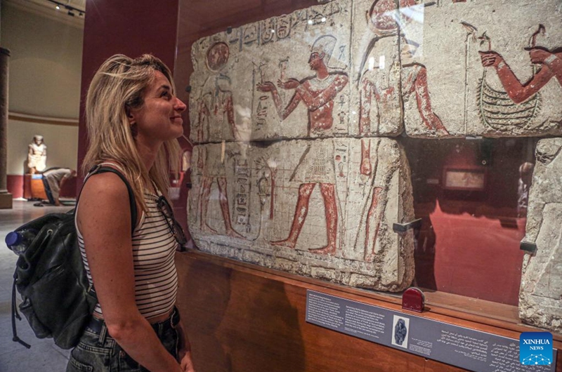 A woman views an antiquity at the Egyptian Museum during the International Museum Day in Cairo, Egypt, on May 18, 2024. Photo: Xinhua