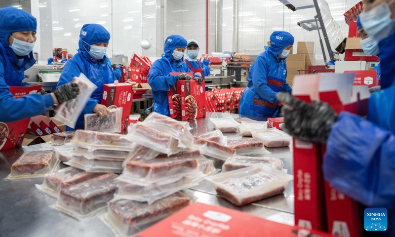 Staff members pack pre-prepared crayfish at a food company in Nanxian County in Yiyang, central China's Hunan Province, May 19, 2024. Nanxian County has been promoting the development of crayfish industry in recent years, with an output value hitting 16 billion yuan (about $2.215 billion). Photo: Xinhua