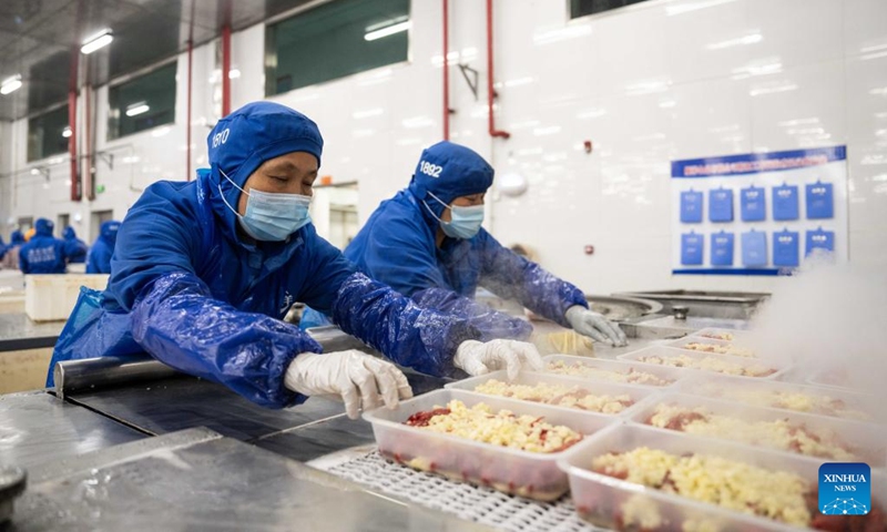 Staff members work at a crayfish workshop of a food company in Nanxian County in Yiyang, central China's Hunan Province, May 19, 2024. Nanxian County has been promoting the development of crayfish industry in recent years, with an output value hitting 16 billion yuan (about $2.215 billion). Photo: Xinhua