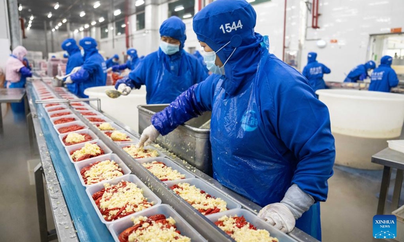 Staff members work at a crayfish workshop of a food company in Nanxian County in Yiyang, central China's Hunan Province, May 19, 2024. Nanxian County has been promoting the development of crayfish industry in recent years, with an output value hitting 16 billion yuan (about $2.215 billion). Photo: Xinhua