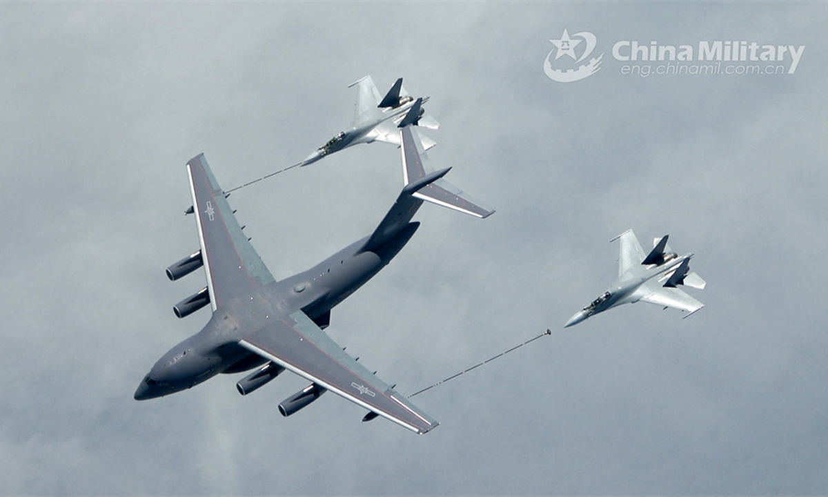 A YY-20 tanker attached to an aviation brigade under the PLA Air Force refuels two J-16 fighter jets during an aerial refueling training exercise in early May, 2024. (eng.chinamil.com.cn/Photo by Zhan Peng)