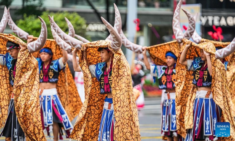 People dressed in ethnic costumes parade in a street in Guiyang, southwest China's Guizhou Province, May 18, 2024. More than 3,200 people participated in this event showcasing the ethnic cultures of Guizhou Province. Photo: Xinhua