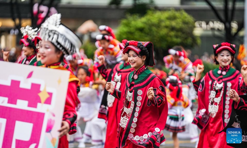 People dressed in ethnic costumes parade in a street in Guiyang, southwest China's Guizhou Province, May 18, 2024. More than 3,200 people participated in this event showcasing the ethnic cultures of Guizhou Province. Photo: Xinhua