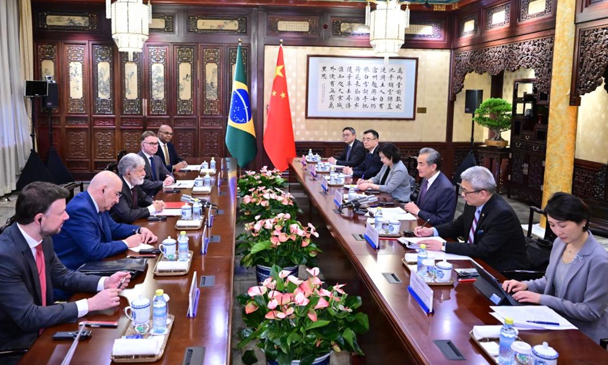 Wang Yi, a member of the Political Bureau of the Communist Party of China (CPC) Central Committee and director of the Office of the Foreign Affairs Commission of the CPC Central Committee, holds talks with Celso Amorim, chief advisor to the President of Brazil, in Beijing, capital of China, May 23, 2024. Photo: Xinhua