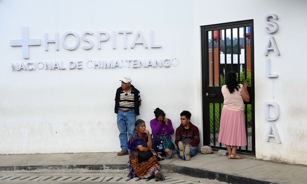 People wait outside the National Hospital of Chimaltenango, which was built with a donation from Taiwan island and whose construction was involved in a corruption case, in Chimaltenango, Guatemala on August 9, 2023. Photo: AFP