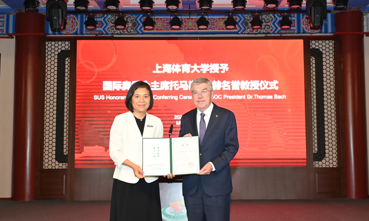 International Olympic Committee President Thomas Bach (right) is appointed honorary professor of the Shanghai University of Sport (SUS) on May 19, 2023. Photo: Courtesy of SUS