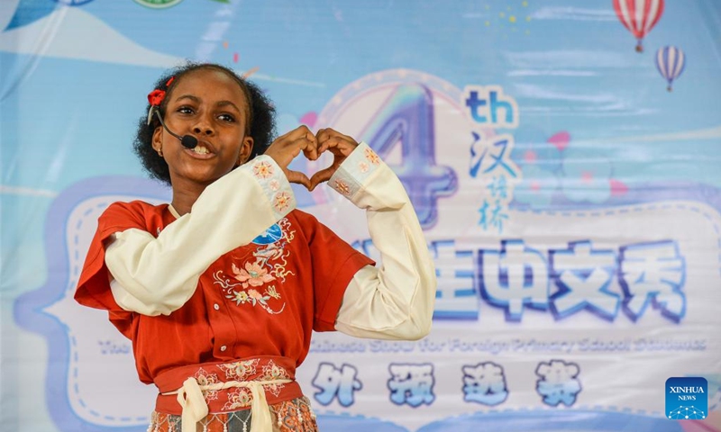 A contestant competes in the Cameroon Finals of the 4th Chinese Bridge Chinese Show Competition for foreign primary school students in Soa, Cameroon, May 18, 2024. The competition was held on Saturday in the Confucius Institute at University of Yaounde II in Soa, Cameroon, with 12 primary school students participated in the event. Photo: Xinhua