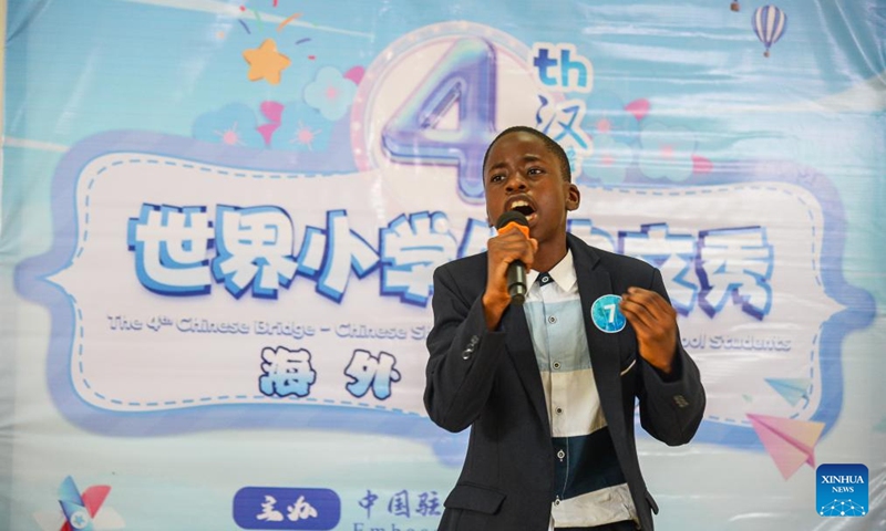 A contestant competes in the Cameroon Finals of the 4th Chinese Bridge Chinese Show Competition for foreign primary school students in Soa, Cameroon, May 18, 2024. The competition was held on Saturday in the Confucius Institute at University of Yaounde II in Soa, Cameroon, with 12 primary school students participated in the event. Photo: Xinhua