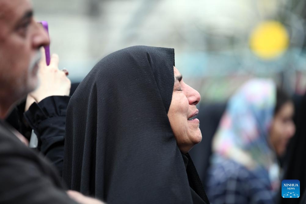 People mourn victims of the helicopter crash near Varzaqan County, in Tehran, Iran, on May 20, 2024. Iranian President Ebrahim Raisi and some members of his accompanying team, including Foreign Minister Hossein Amir-Abdollahian, were confirmed dead Monday morning as the wreckage of the helicopter carrying them was found following its crash in bad weather on Sunday near Varzaqan County.(Photo: Xinhua)