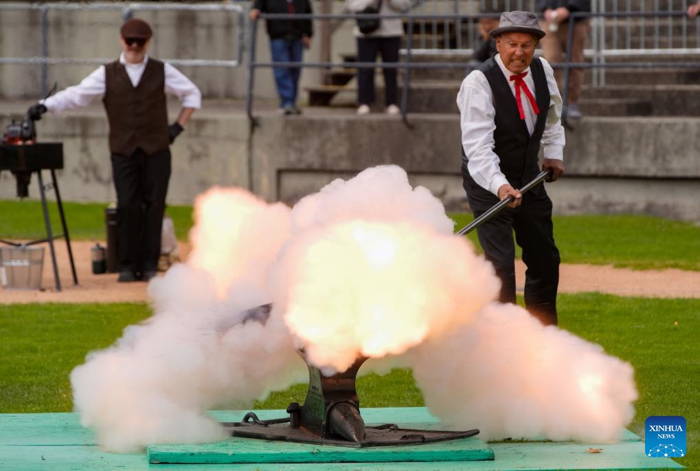 A member of the Ancient and Honourable Hyack Anvil Battery fires one of 21 salutes during the Victoria Day Anvil Battery Salute at Queen's Park Stadium in New Westminster, British Columbia, Canada, on May 20, 2024. Anvil salute is an annual tradition in the city of New Westminster dating back to the 1860s on Victoria Day.(Photo: Xinhua)