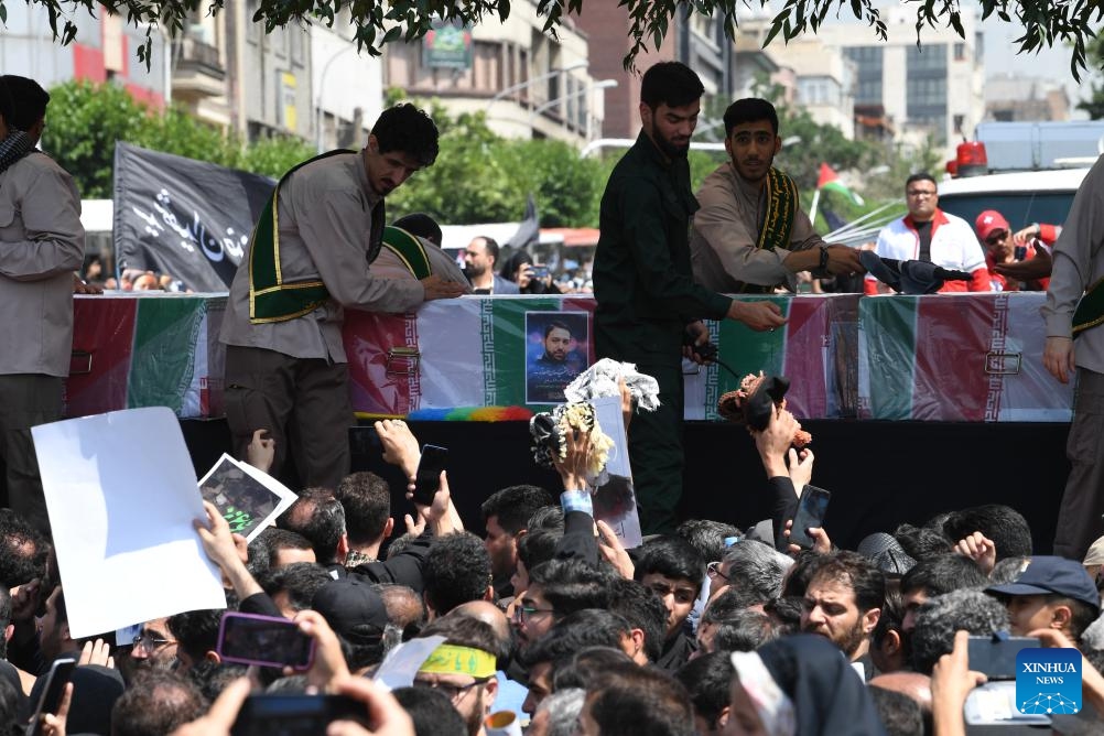 People attend a memorial event held for Iran's late President Ebrahim Raisi, late Foreign Minister Hossein Amir-Abdollahian and others in Tehran, Iran, May 22, 2024.(Photo: Xinhua)