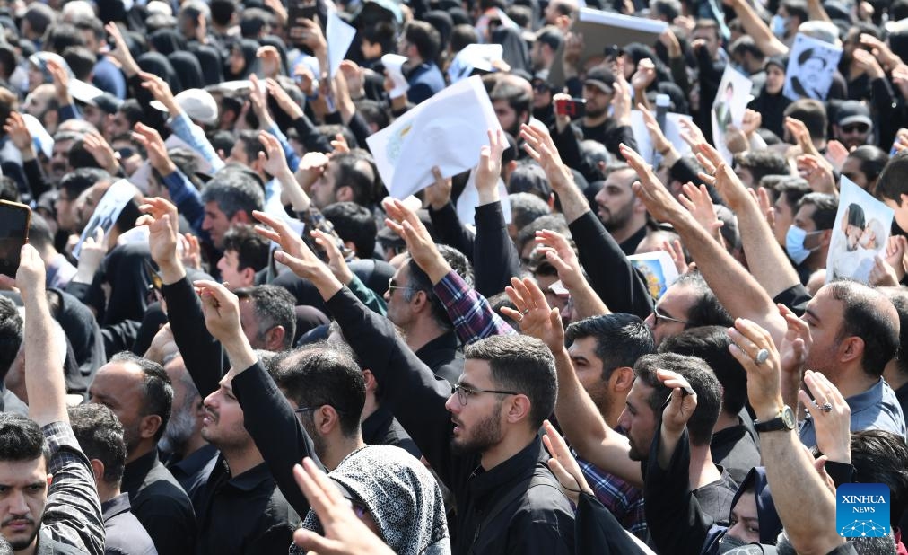 People attend a memorial event held for Iran's late President Ebrahim Raisi, late Foreign Minister Hossein Amir-Abdollahian and others in Tehran, Iran, May 22, 2024.(Photo: Xinhua)