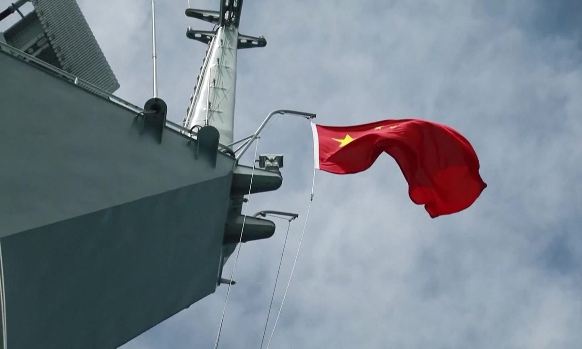 The Chinese national flag waves on a Chinese People's Liberation Army warship as it conducts joint military drills surrounding the island of Taiwan on May, 23 2024. Photo: IC